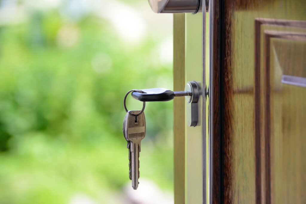 Home door lock with key dangling